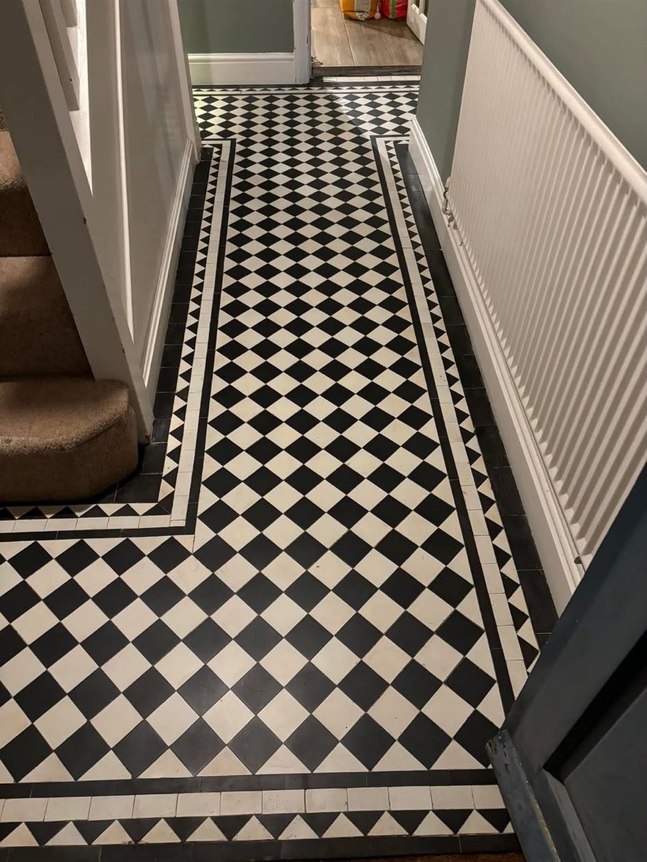 Black and white Victorian tiled hallway before cleaning
